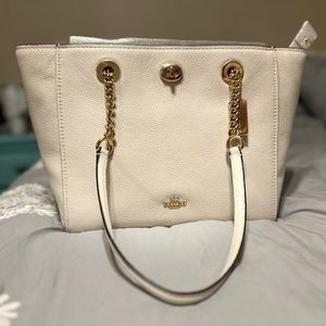 Cream colored Coach bag